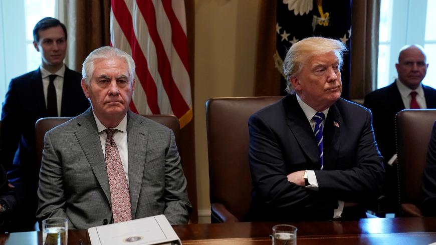 U.S. President Donald Trump and Secretary of State Rex Tillerson look up during a Cabinet meeting at the White House in Washington, U.S., November 20, 2017.  REUTERS/Kevin Lamarque - RC1F667E9200