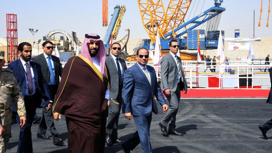 Egyptian President Abdel Fattah al-Sisi and Saudi Crown Prince Mohammad Bin Salman visit the Suez Canal at the city of Ismailia, Egypt, March 5, 2018, in this handout picture courtesy of the Egyptian Presidency. The Egyptian Presidency/Handout via REUTERS ATTENTION EDITORS - THIS IMAGE WAS PROVIDED BY A THIRD PARTY - RC18F7347430