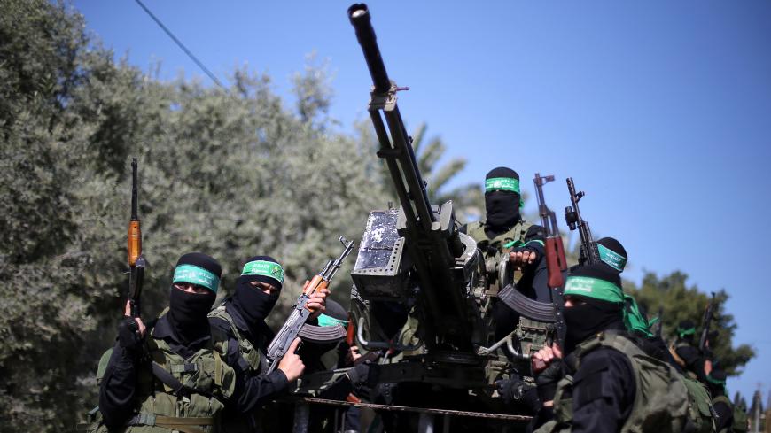 Palestinian Hamas militants attend a military drill in preparation to any upcoming confrontation with Israel, in the southern Gaza Strip March 25, 2018. REUTERS/Ibraheem Abu Mustafa - RC1B884125E0