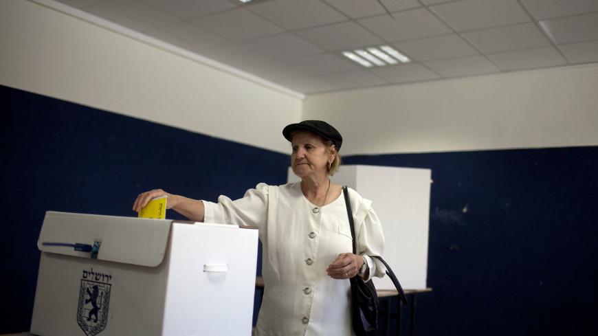JERUSALEM, ISRAEL - OCTOBER 22:  (ISRAEL OUT) An Israeli woman casts her vote for the municipality elections at a polling station on October 22, 2013 in Jerusalem, Israel. Elections for 191 local authorities are being held today, including in Jerusalem where the Haredi-backed Moshe Leon will challenge incumbent Mayor Nir Barkat in the mostly highly-anticipated race. (Photo by Lior Mizrahi/Getty Images)