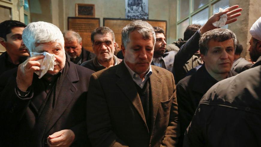 Mohammad Hashemi Rafsanjani (L) and Mohsen Hashemi (C), the brother and son of late former Iranian president Akbar Hashemi Rafsanjani, attends his father's mourning ceremony at Jamaran mosque in Tehran, on January 8, 2017.
Rafsanjani died in hospital on January 8 after suffering a eart attack. Rafsanjani, who was 82, was a pivotal figure in the foundation of the Islamic republic in 1979, and served as president from 1989 to 1997. / AFP / ATTA KENARE        (Photo credit should read ATTA KENARE/AFP/Getty Ima