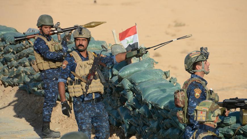 Iraqi security forces members hold a position as they advance towards the Salaheddine province in the western desert bordering Syria, on November 26, 2017, in a bid to flush out remaining Islamic State (IS) group fighters in the al-Jazeera region.
Iraqi forces thrust north from the Euphrates Valley into the desert a day earlier, opening up a new front in the drive to flush out fugitive Islamic State group fighters, a commander told AFP. / AFP PHOTO        (Photo credit should read /AFP/Getty Images)