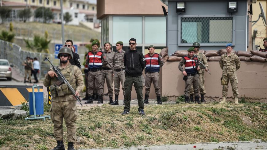 Turkish soldiers stand guard at the entrance of the Aliaga court and prison complex, during the trial of US pastor Andrew Brunson, held on charges of aiding terror groups, in Aliaga, north of Izmir, on April 16, 2018.
Brunson, who ran a church in the western city of Izmir, was detained by Turkish authorities in October 2016. If convicted, he risks up to 35 years in jail. / AFP PHOTO / OZAN KOSE        (Photo credit should read OZAN KOSE/AFP/Getty Images)
