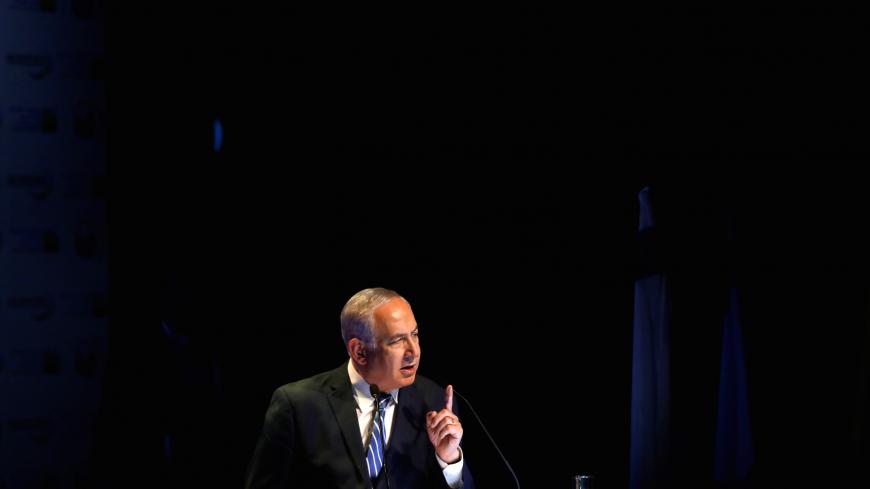 Israeli Prime Minister Benjamin Netanyahu speaks during a regional development conference in Dimona, southern Israel, March 20, 2018. REUTERS/Ronen Zvulun - RC13BCC74340