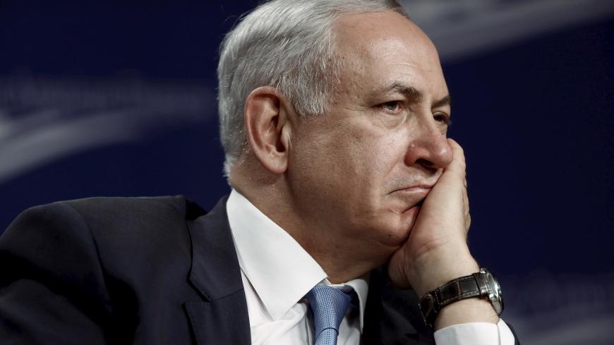 Israel's Prime Minister Benjamin Netanyahu listens to a question as he participates in a forum hosted by the Center for American Progress in Washington November 10, 2015. Netanyahu assured U.S. President Barack Obama on Monday that he remained committed to a two-state solution to the Israeli-Palestinian conflict as they sought to mend ties strained by acrimony over Middle East diplomacy and Iran. REUTERS/Jonathan Ernst - GF20000053876
