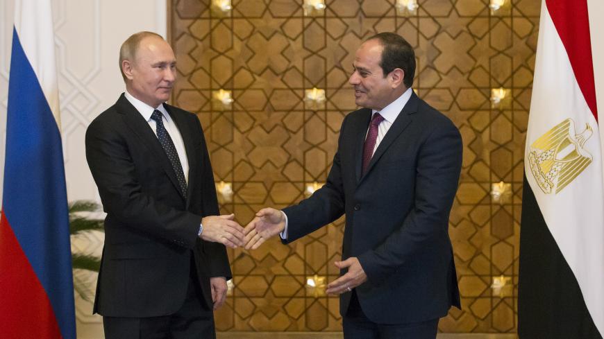 Russia's President Vladimir Putin (L) meets with Egypt's President Abdel Fattah al-Sisi in Cairo, Egypt December 11, 2017. REUTERS/Alexander Zemlianichenko/Pool - UP1EDCB0X5711