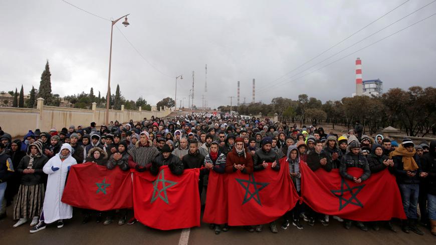 People march and shout slogans during a protest against the lack of jobs and poverty in Jerada, Morocco February 10, 2018. REUTERS/Youssef Boudlal - RC13615CF410