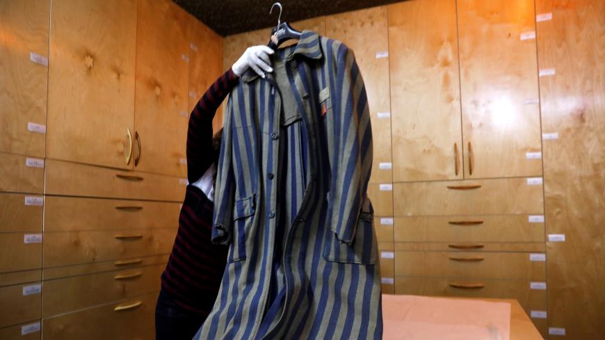 An original prisoner's coat (not on general display) is seen at the artifacts department of the Yad Vashem World Holocaust Remembrance Center in Jerusalem, ahead of the Israeli annual Holocaust Remembrance Day, April 10, 2018. Picture taken April 10, 2018. REUTERS/Ronen Zvulun - RC1A0B40CE00