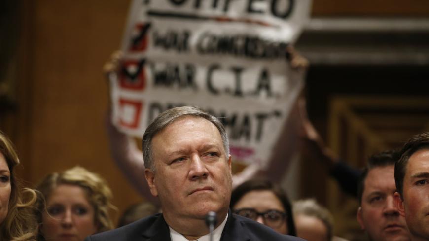 Protesters voice their opposition as CIA Director Mike Pompeo testifies before a Senate Foreign Relations Committee confirmation hearing on Pompeoís nomination to be secretary of state on Capitol Hill in Washington, U.S., April 12, 2018. REUTERS/Leah Millis - HP1EE4C163E9Q