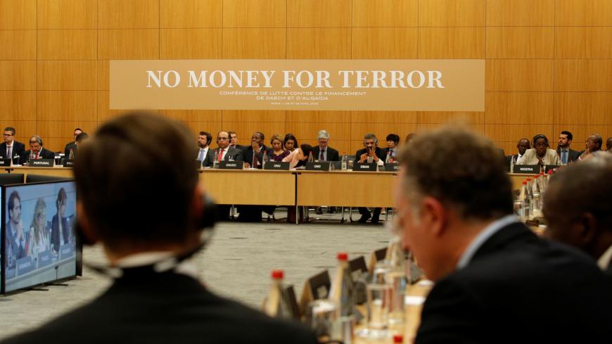 Participants attend a round table with international delegations at a conference to discuss ways of cutting funding to groups including Islamic State and al-Qaeda, at the Organisation for Economic Co-operation and Development (OECD) headquarters in Paris, France, April 26, 2018.  REUTERS/Philippe Wojazer/Pool - RC1775AF2BE0