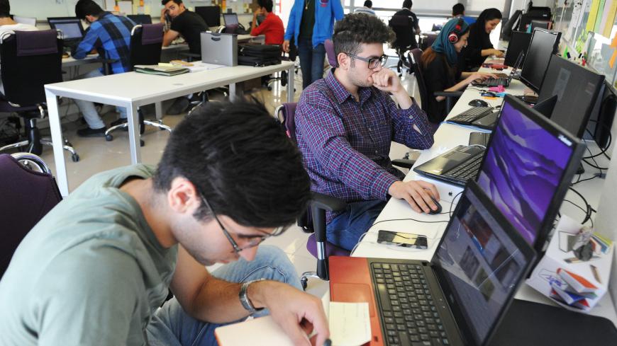 TEHRAN, IRAN - JULY 12: Young Iranian high-tech and start-up specialists work their computers at Sarava, a local venture capital firm that invests in start-ups at Pardis Technology Park, 15 miles east of Tehran, Iran, on July 12, 2015. After the Iran nuclear deal was signed on July 14 that will lift sanctions in exchange for capping Iran's nuclear program, Iranian companies are preparing to return to global financial and trade networks, and expect billions of dollars in investments. President Hassan Rouhani