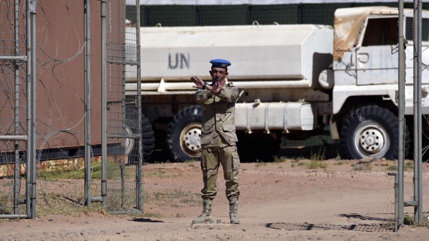 A member of the United Nations peace mission MINURSO gestures during a visit of the UN chief at a UN base in Bir-Lahlou, in the disputed territory of Western Sahara, situated 220 kilometres (137 miles) southwest of the Algerian town of Tindouf, on March 5, 2016. / AFP / Farouk Batiche        (Photo credit should read FAROUK BATICHE/AFP/Getty Images)