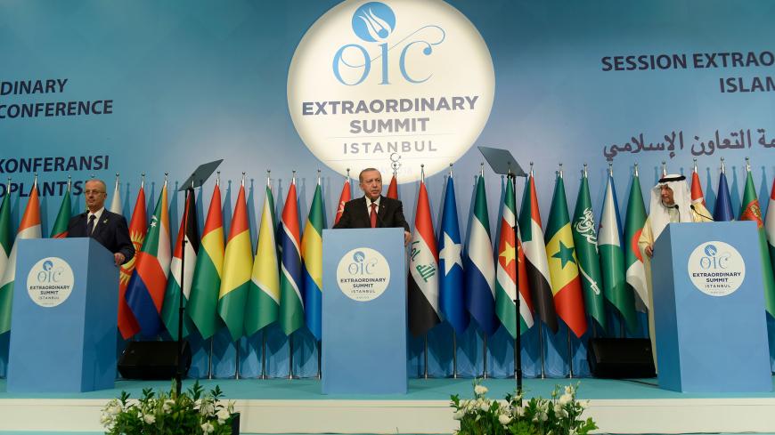 Turkish President Recep Tayyip Erdogan (C), Palestinian Prime Minister Rami Al Hamdallah (L) and The Secretary General of The Organisation Of Islamic Cooperation (OIC) Yousef Ahmed Al-Othaimeen (R) address a press conference at the extraordinary summit of the Organisation of Islamic Cooperation (OIC) in Istanbul early May 19, 2018. - The Organisation of Islamic Cooperation (OIC) held an extraordinary summit in Istanbul to show solidarity with the Palestinian people following the opening of US Embassy in Jer