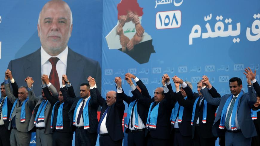 Iraqi Prime Minister Haider al-Abadi attends the election campaign, along with his supporters, ahead of the parliamentary election in Kerbala, Iraq May 4, 2018. REUTERS/Abdullah Dhiaa al-Deen - RC19D2EB8110