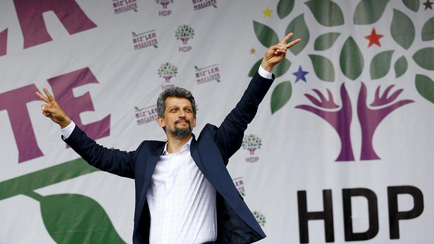 Garo Paylan, newly elected Armenian lawmaker from the Pro-Kurdish Peoples' Democratic Party (HDP), greets supporters during a gathering to celebrate the party's victory during the parliamentary election, in Istanbul, Turkey, June 8, 2015. A record number of women, together with Christians, ethnic Kurds and Armenians, are set to enter Turkey's parliament after Sunday's election, a huge shift for a country that has long viewed demands for diversity as a threat to national unity. A total of 97 female lawmakers