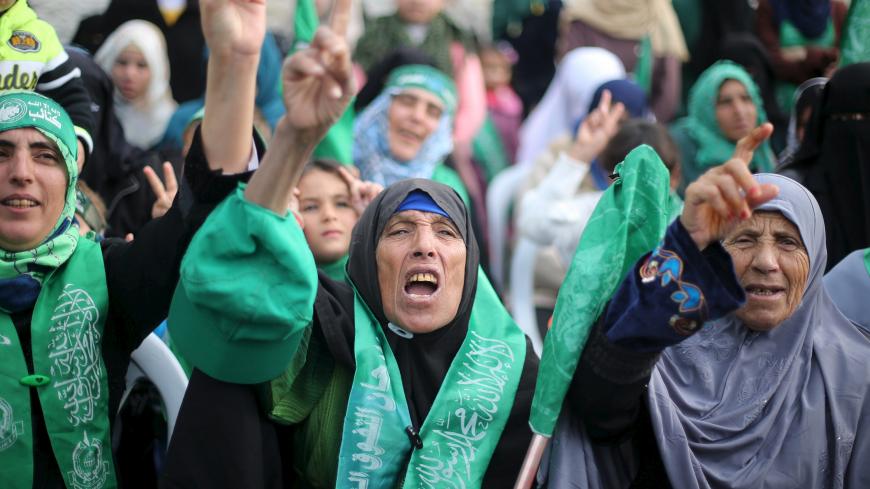 Palestinian women take part in a rally ahead of the 28th anniversary of Hamas' founding, in Khan Younis in the southern Gaza Strip December 11, 2015. The Islamist group Hamas will celebrate its 28th anniversary of founding on December 14. REUTERS/Ibraheem Abu Mustafa  - GF10000262464
