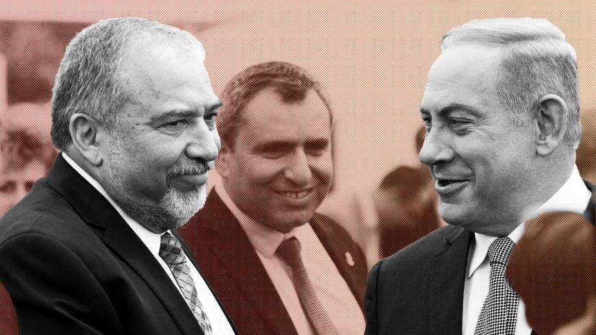 Israeli Prime Minister Benjamin Netanyahu (R) and Israel's defense minister, Avigdor Lieberman (L) during a special Cabinet meeting to mark Jerusalem Day in 1Ein Lavan Spring located in the outskirts of Jerusalem 02 June 2016. REUTERS/Abir Sultan/Pool - S1AETHOLEQAC