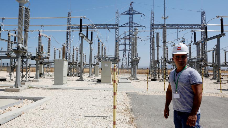 An Israeli engineer stands in the new electrical substation near the West Bank city of Jenin July 10, 2017. REUTERS/Abed Omar Qusini - RC1231051DF0