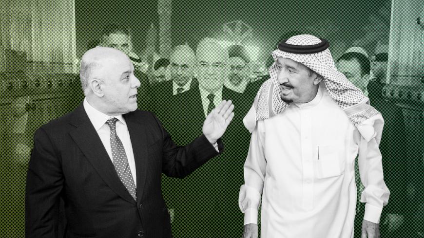 Saudi Arabia's King Salman bin Abdulaziz Al Saud welcomes Iraqi Prime Minister Haider Al-Abadi in Riyadh, Saudi Arabia October 21, 2017. Bandar Algaloud/Courtesy of Saudi Royal Court/Handout via REUTERS ATTENTION EDITORS - THIS PICTURE WAS PROVIDED BY A THIRD PARTY. - RC122DCA3BC0