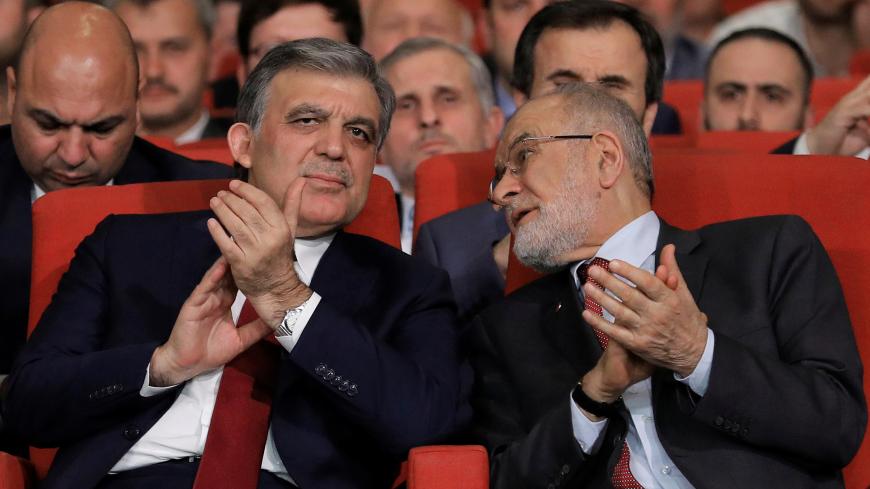 Former Turkish President Abdullah Gul is seen with Saadet Party leader Temel Karamollaoglu during a ceremony in Istanbul, Turkey April 24, 2018. Picture taken April 24, 2018. REUTERS/Huseyin Aldemir - RC1A875ACB30