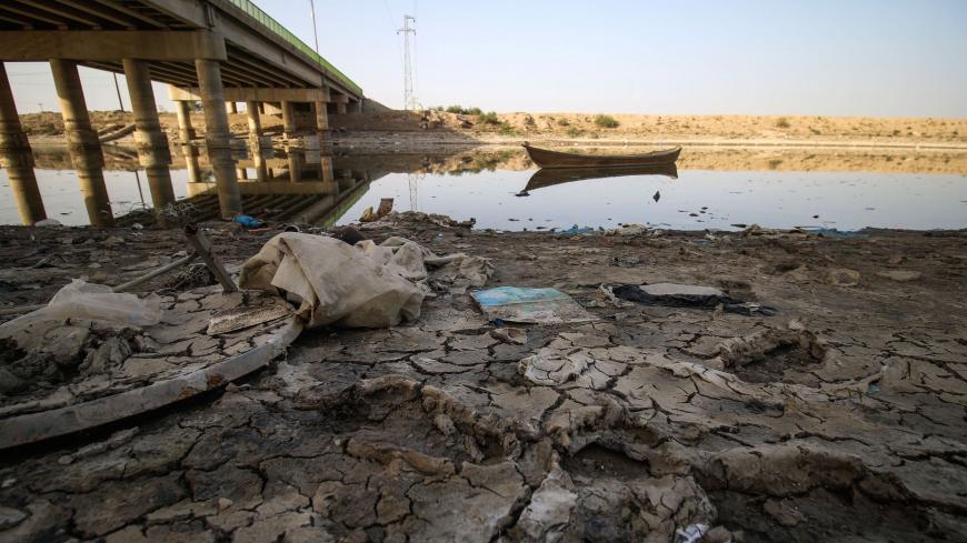 A picture taken on March 20, 2018 shows a view of the dried-up shore of an irrigation canal near the village of Sayyed Dakhil, to the east of Nasariyah city some 300 kilometres (180 miles) south of Baghdad. - Farmers in Sayyed Dakhil have traditionally lived off their land where there used to be no need for wells, but a creeping drought is now threatening agriculture and livelihoods in the area.
Weather patterns are largely to blame for the crisis, but while rain accounts for 30 percent of Iraq's water reso