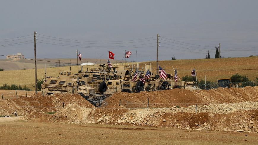 A picture taken on May 8, 2018 shows vehicles of the US-backed coalition forces in the northern Syrian town of Manbij. - The Syrian Observatory for Human Rights, a Britain-based monitor with sources on the ground, says around 350 members of the US-led coalition -- mostly American troops -- are stationed around Manbij. (Photo by Delil souleiman / AFP)        (Photo credit should read DELIL SOULEIMAN/AFP/Getty Images)