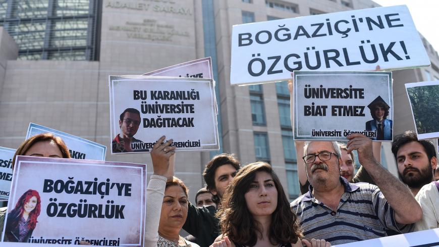 People demonstrate outside the Caglayan courthouse on June 6, 2018 in Istanbul with banners reading "Freedom for Bogazici" as a trial opens today of 21 students from Bogazici University described by Turkey's President as "terrorists" after they opposed the Turkish military operation in Syria launched in January 2018. (Photo by Yasin AKGUL / AFP)        (Photo credit should read YASIN AKGUL/AFP/Getty Images)