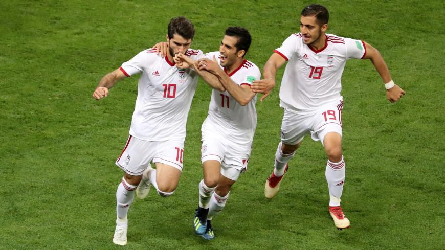 Soccer Football - World Cup - Group B - Iran vs Portugal - Mordovia Arena, Saransk, Russia - June 25, 2018   Iran's Karim Ansarifard celebrates scoring their first goal with Vahid Amiri and Majid Hosseini    REUTERS/Lucy Nicholson     TPX IMAGES OF THE DAY - RC15E3C90680