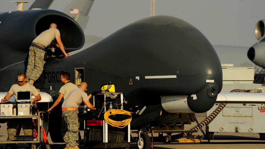 U.S. Air Force maintainers prepare a U.S. military drone RQ-4A Global Hawk for takeoff at an undisclosed location in Southwest Asia, December 2, 2010. Picture taken December 2, 2010. Courtesy Eric Harris/U.S. Air Force/Handout via REUTERS   ATTENTION EDITORS - THIS IMAGE HAS BEEN SUPPLIED BY A THIRD PARTY. - RC17D81CAF00