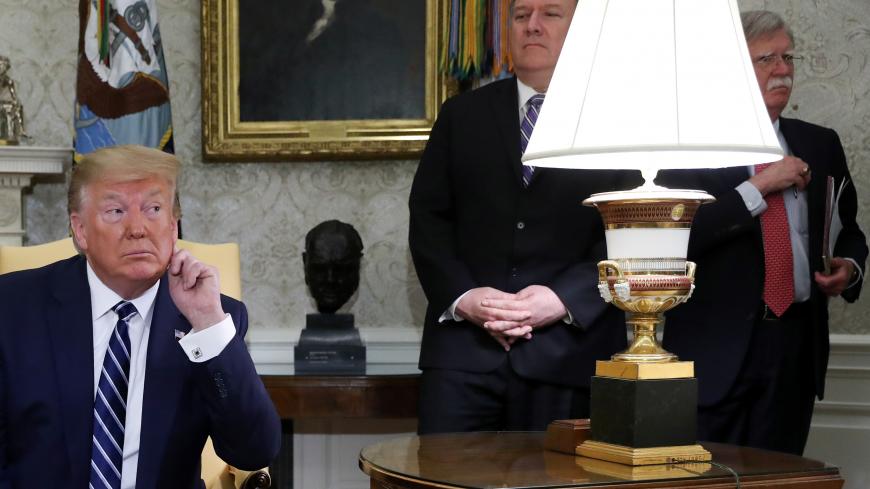U.S. President Donald Trump listens to questions during a meeting with Canada's Prime Minister Justin Trudeau as Secretary of State Mike Pompeo and White House national security adviser John Bolton look on in the Oval Office of the White House in Washington, U.S., June 20, 2019. REUTERS/Jonathan Ernst - RC1ACBBDB270