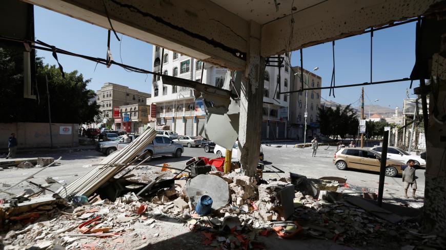 A view of damage on a street where Houthis have recently clashed with forces loyal to slain Yemeni former president Ali Abdullah Saleh in Sanaa, Yemen December 6, 2017. REUTERS/Khaled Abdullah - RC1476393DB0