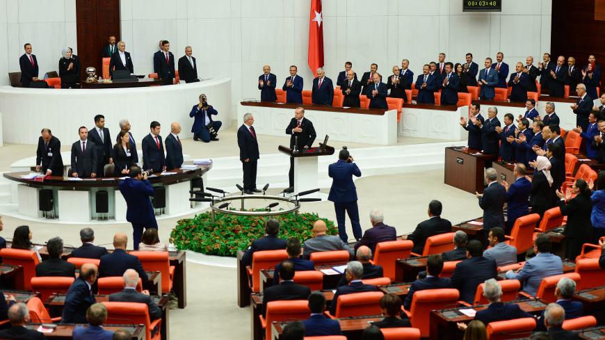 ANKARA, TURKEY - JULY 9: Turkey's President Recep Tayyip Erdogan receives his oath as he is sworns as Turkey's first Executive President at the Turkish parliament on July 9, 2018 in Ankara, Turkey. President Erdogan was sworn in during a parliamentary meeting and later an inauguration ceremony attended by a number of foreign leaders and dignitaries. President Erdogan secured another five year term and increased powers after winning 52.5 percent of the vote in the June 24 snap presidential and parliamentary 