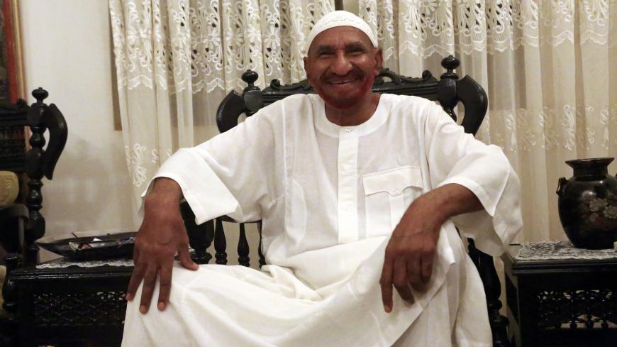 Opposition leader of Umma Party and Sudan's former Prime Minister Sadiq al-Mahdi smiles at his home in Omdurman after he was released, June 15, 2014. Sudanese authorities released al-Mahdi on Sunday, in a signal of the government's intent to ease political tensions ahead of elections next year. Al-Mahdi, who was arrested in mid-May, was accused of undermining the constitution, a charge that could have led to the death penalty, after he said the government had committed violence against civilians in the Darf