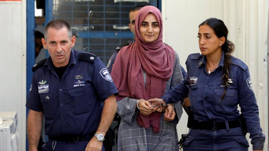 Turkish citizen, Ebru Ozkan, who was arrested at an Israeli airport last month, is being brought to an Israeli military court, near Migdal, Israel July 8, 2018 REUTERS/Nir Elias - RC12410D5420