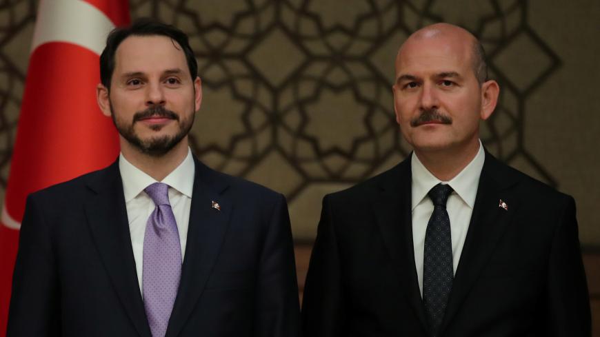 Turkish President Tayyip Erdogan's son-in-law and newly appointed Treasury and Finance Minister Berat Albayrak (L) and Interior Minister Suleyman Soylu stand next to each other during a presser at the Presidential Palace in Ankara, Turkey July 9, 2018. REUTERS/Umit Bektas - RC1A333464E0