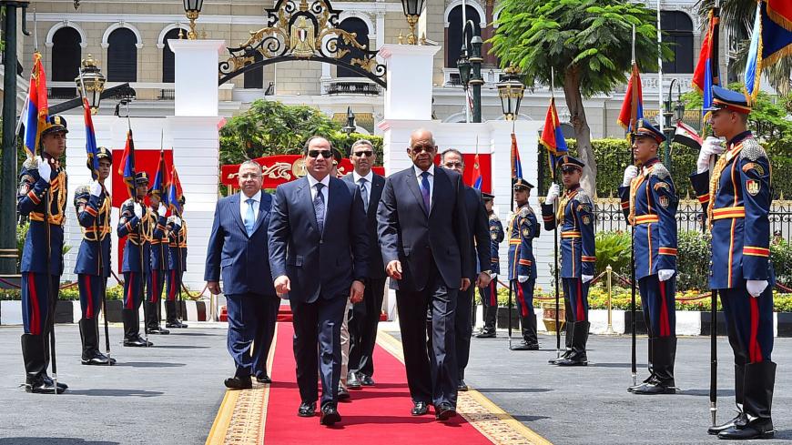 Egyptian President Abdel Fattah Al Sisi arrives next to Egypt's parliament speaker Ali Abdel Aal, for his swearing-in of the second presidential term, at the House of Representatives in Cairo, Egypt, June 2, 2018 in this handout picture courtesy of the Egyptian Presidency. The Egyptian Presidency/Handout via REUTERS ATTENTION EDITORS - THIS IMAGE WAS PROVIDED BY A THIRD PARTY - RC1BEE94FAD0