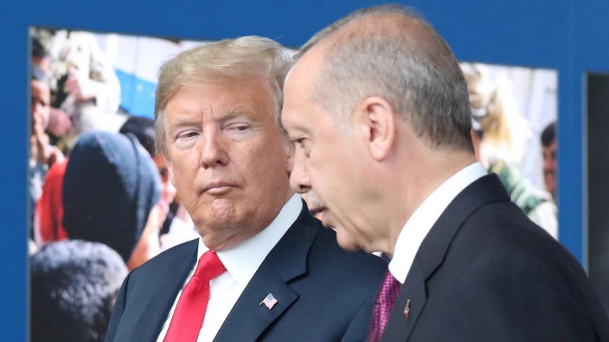 US President Donald Trump (L) talks to Turkeyís President Recep Tayyip Erdogan (R) at NATO headquarters in Brussels, Belgium, 11 July 2018. NATO countries' heads of states and governments gather in Brussels for a two-day meeting.      /Pool via REUTERS - RC13CF6D4C90