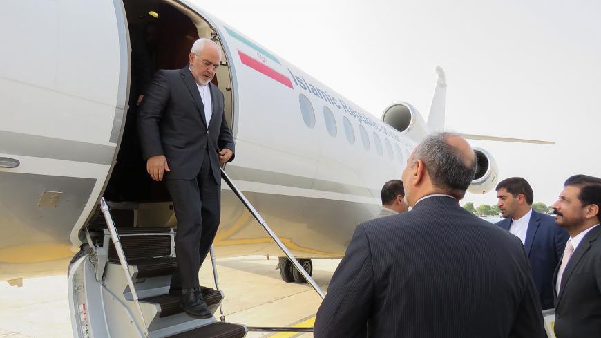 Iranian Foreign Minister Javad Zarif steps down from his plane on his arrival in Noor Khan airbase in Rawalpindi on August 30, 2018. - Iranian Foreign Minister Javad Zarif arrived in Islamabad for a two-day visit. (Photo by - / AFP)        (Photo credit should read -/AFP/Getty Images)