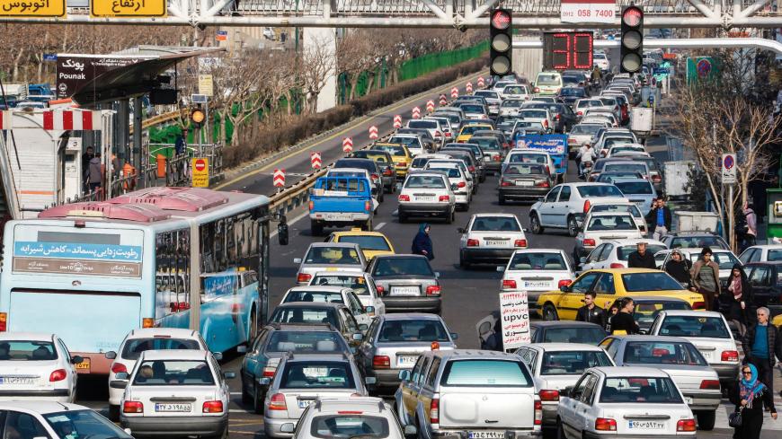 A picture taken on January 14, 2017 shows street traffic in the Iranian capital Tehran on the first anniversary of the nuclear agreement.
The first anniversary, of the nuclear deal between Iran and six powers, that lifted a large part of international sanctions on Iran in return for limits on Tehran's nuclear programme, comes four days before the inauguration of Republican president Trump on January 20. / AFP / ATTA KENARE        (Photo credit should read ATTA KENARE/AFP/Getty Images)