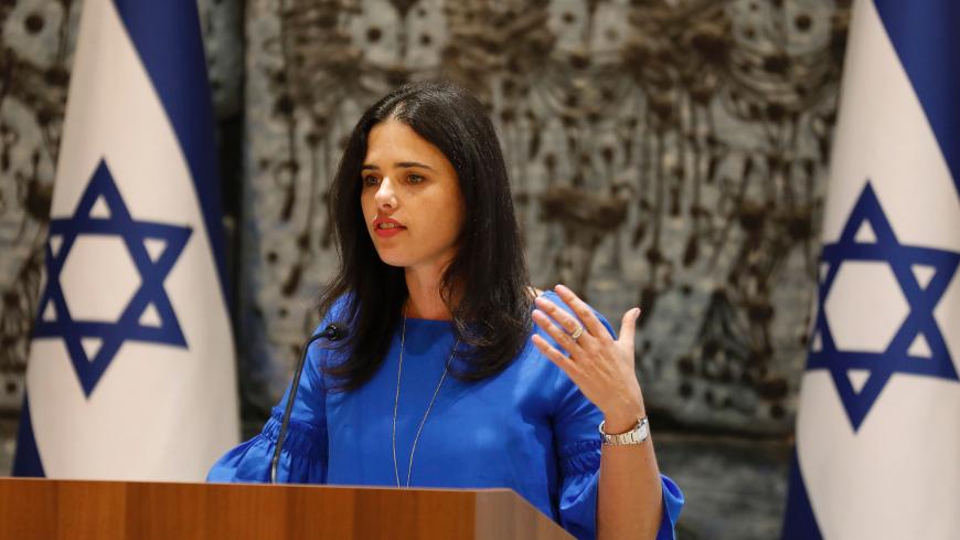 Israeli Justice Minister Ayelet Shaked speaks during the swearing in ceremony of Israeli Muslim Hana Khatib, the first woman in Israel to be appointed by an Israeli justice committee to become a religious judge, or qadi, in the courts ruling on personal law for Muslims, at the Presidents Residence in Jerusalem on May 15, 2017.
Khatib is the first woman not only for the Muslim sharia courts but for all the religious courts in Israel, as no women serve as judges in the Jewish or Druze courts. / AFP PHOTO / GA