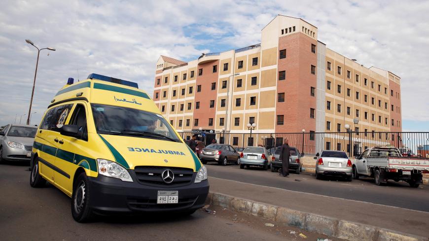 An ambulance drives past the Suez Canal University hospital, where victims of the Al Rawdah mosque attack are being treated in Ismailia, Egypt November 25, 2017. REUTERS/Amr Abdallah Dalsh - RC1D4CB3B1D0
