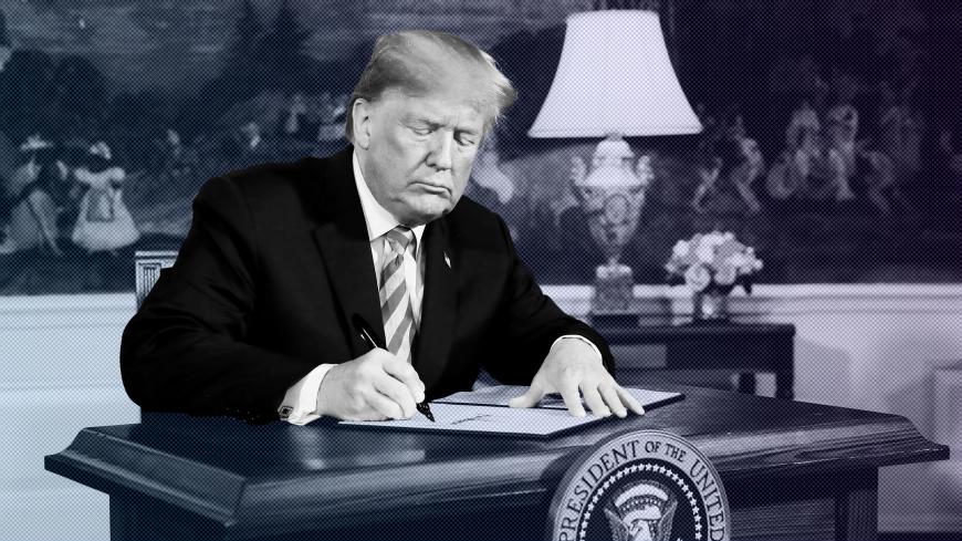 U.S. President Donald Trump signs a proclamation declaring his intention to withdraw from the JCPOA Iran nuclear agreement in the Diplomatic Room at the White House in Washington, U.S., May 8, 2018. REUTERS/Jonathan Ernst     TPX IMAGES OF THE DAY - RC157E042900