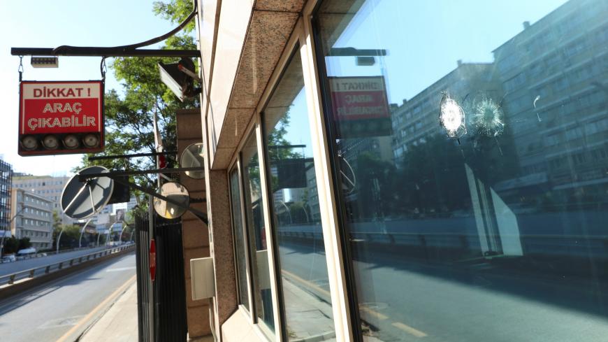 Impacts of bullets are seen in a window of the U.S. Embassy in Ankara, Turkey August 20, 2018. REUTERS/Tumay Berkin - RC1EF49A3800