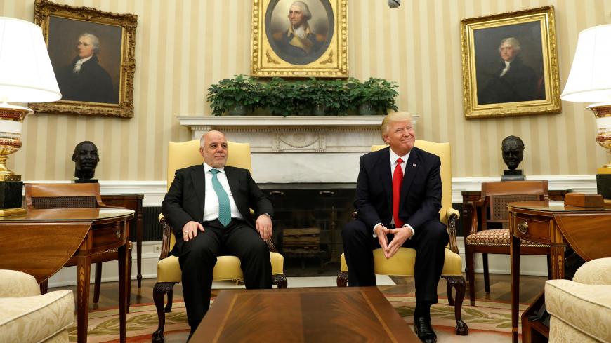 U.S. President Donald Trump meets with Iraqi Prime Minister Haider al-Abadi in the Oval Office at the White House in Washington, U.S., March 20, 2017. REUTERS/Kevin Lamarque - RC16A27D6260