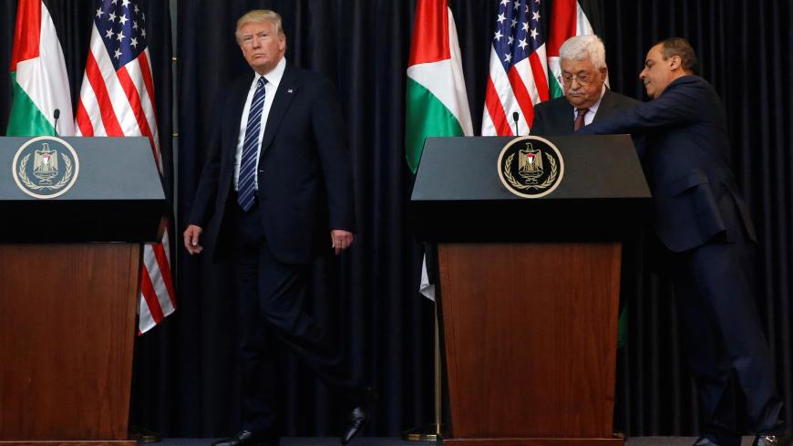 U.S. President Donald Trump (L) and Palestinian President Mahmoud Abbas (2nd R) arrive to deliver remarks after their meeting at the Presidential Palace in the West Bank city of Bethlehem May 23, 2017. REUTERS/Jonathan Ernst - RC1ACE895740