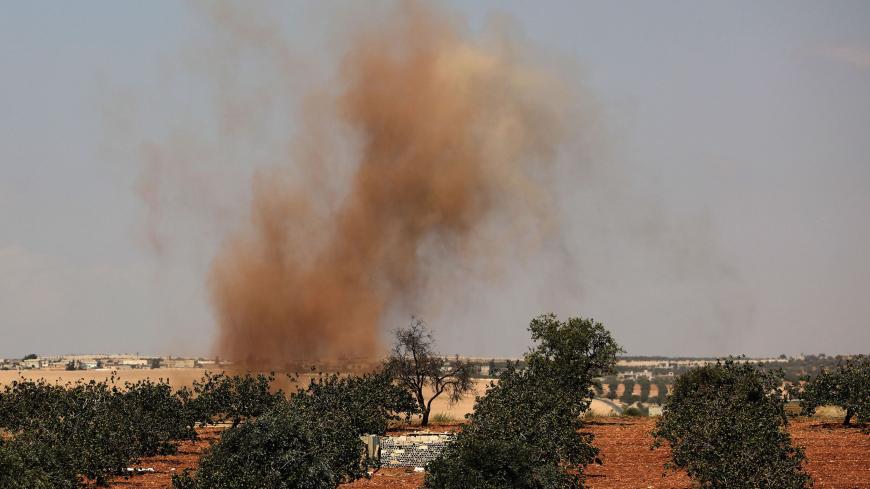This picture taken on September 6, 2018 shows smoke plumes rising from Syrian government forces' bombardment on the town of Al-Tamanah on the southern edges of the rebel-held Idlib province. - Government and allied forces have been massing around the northwestern province of Idlib, where aid groups fear what could be the last major battle of Syria's seven-year war would also be the deadliest. (Photo by OMAR HAJ KADOUR / AFP)        (Photo credit should read OMAR HAJ KADOUR/AFP/Getty Images)