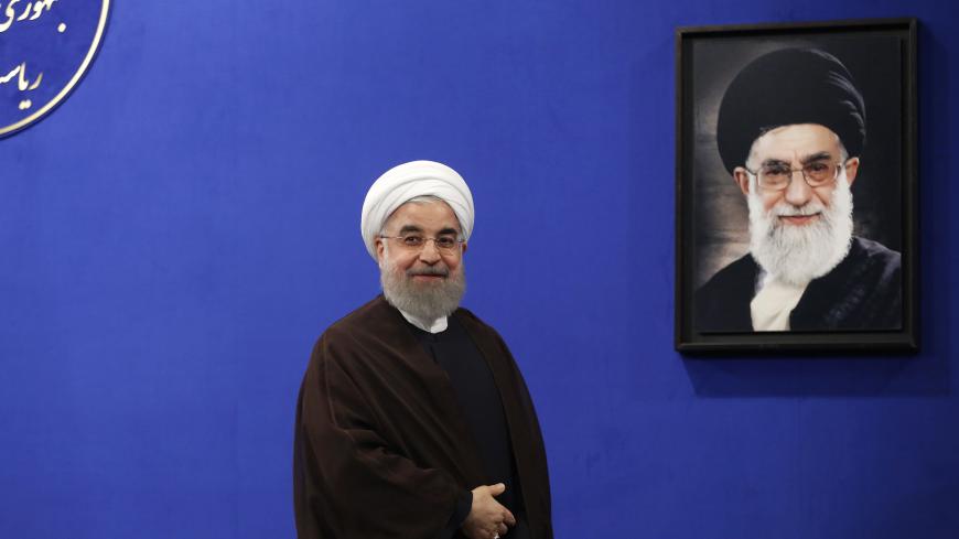 Newly re-elected Iranian President Hassan Rouhani gestures after delivering a televised speech in the capital Tehran on May 20, 2017. A portrait of Iran's Supreme Leader Ayatollah Ali Khamenei is seen in the background.
Iranians have chosen the "path of engagement with the world" and rejected extremism, President Hassan Rouhani said following his resounding re-election victory. / AFP PHOTO / ATTA KENARE        (Photo credit should read ATTA KENARE/AFP/Getty Images)