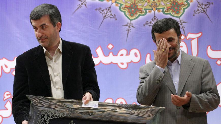 Iran's President Mahmoud Ahmadinejad (R) and First Vice President Esfandiar Rahim Mashaei attend a ceremony in Tehran July 22, 2009. Ahmadinejad, re-elected for a second four-year term in a disputed presidential vote last month, has come under fire from fellow conservatives and hardliners for appointing Mashaie last Thursday. 
REUTERS/Yalda Moaiery (IRAN POLITICS IMAGES OF THE DAY) - GM1E57N01IL01