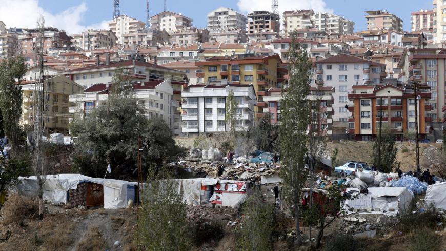 Makeshift tents of Syrian refugees are seen in a wooded area in central Ankara October 5, 2013. Some 150 Syrians, mostly from villages near Syria's Aleppo, prefer to settle in the central Turkish capital instead of refugee camps run by the Turkish government. According to the families, this allows them to work as daily workers. Most of them collect plastic and paper garbage from the trash cans of buildings for recycling and sell it to make money. REUTERS/Umit Bektas (TURKEY - Tags: SOCIETY IMMIGRATION POLIT