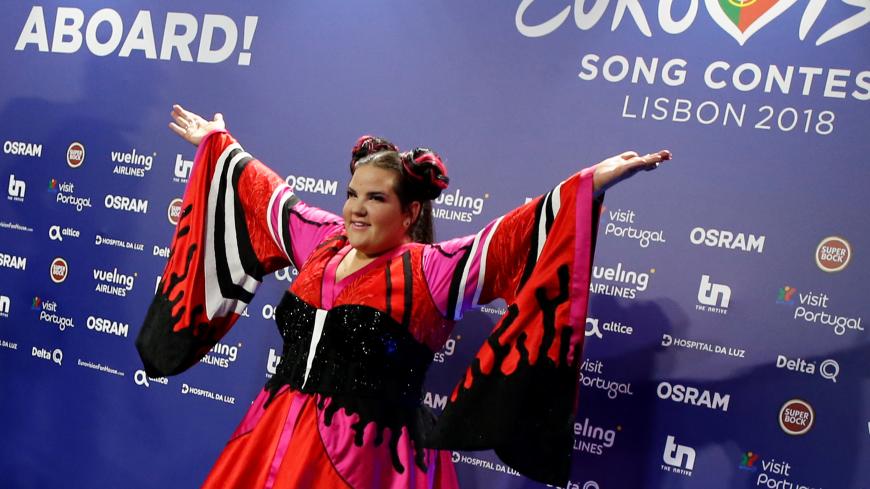 Israel's Netta arrives for the news conference after winning the Grand Final of Eurovision Song Contest 2018 at the Altice Arena hall in Lisbon, Portugal, May 13, 2018.  REUTERS/Pedro Nunes - RC1562380820